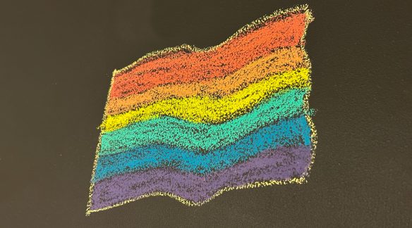 Chalk drawing of a Pride flag.