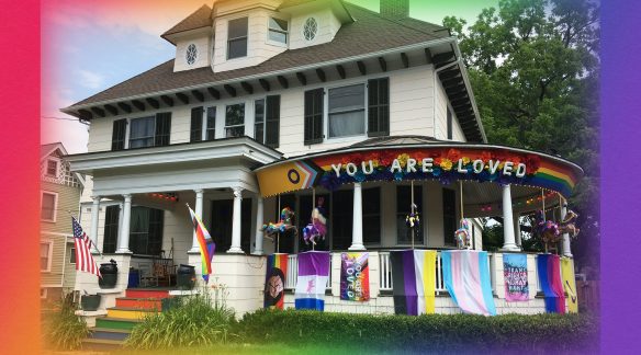 A house adorned with Pride Month flags.