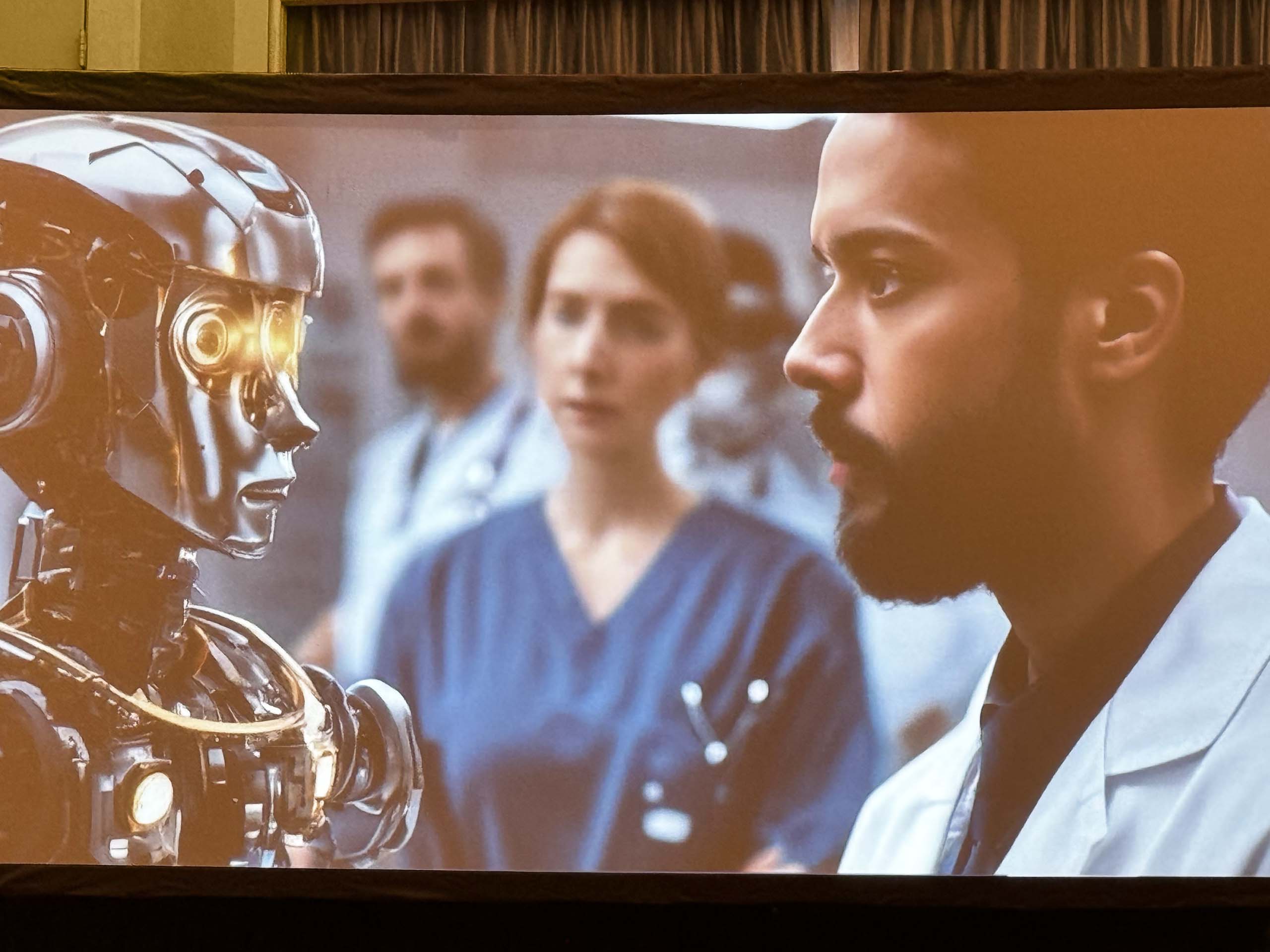 A presentation slide: A man and a robot staring at each other.