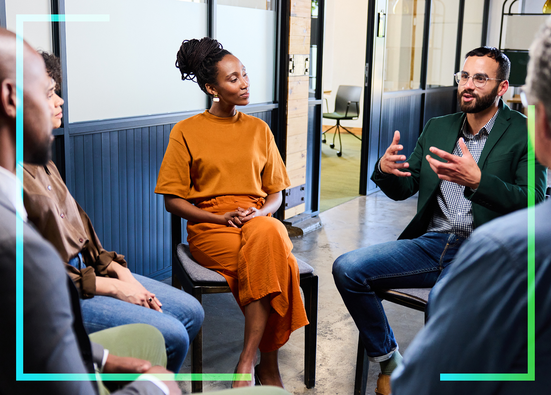 Blog header image of four people discussing how to invest in their employer brand.